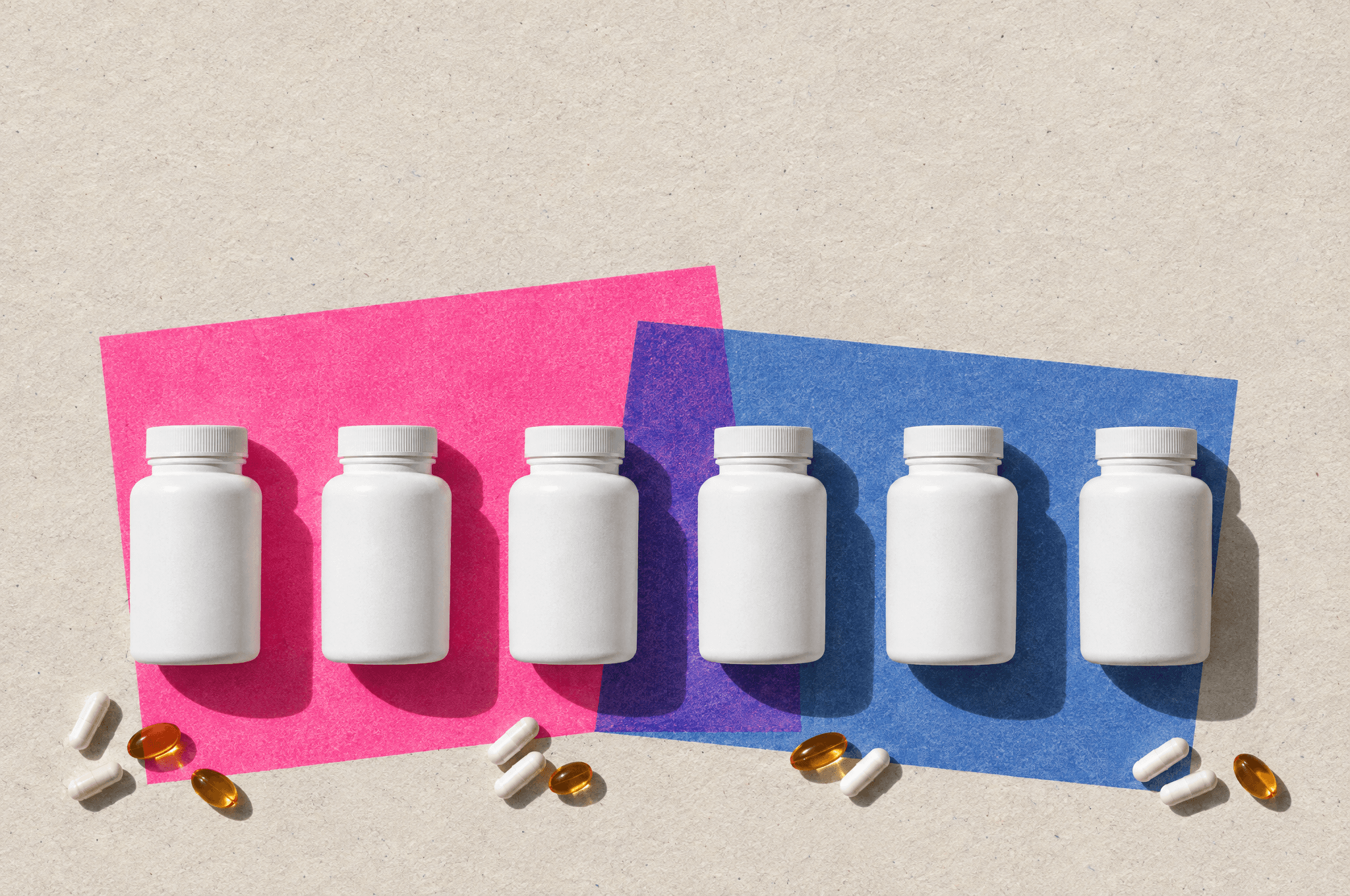 Six plain white bottles in a row on newsprint, with pink and blue paper behind them.